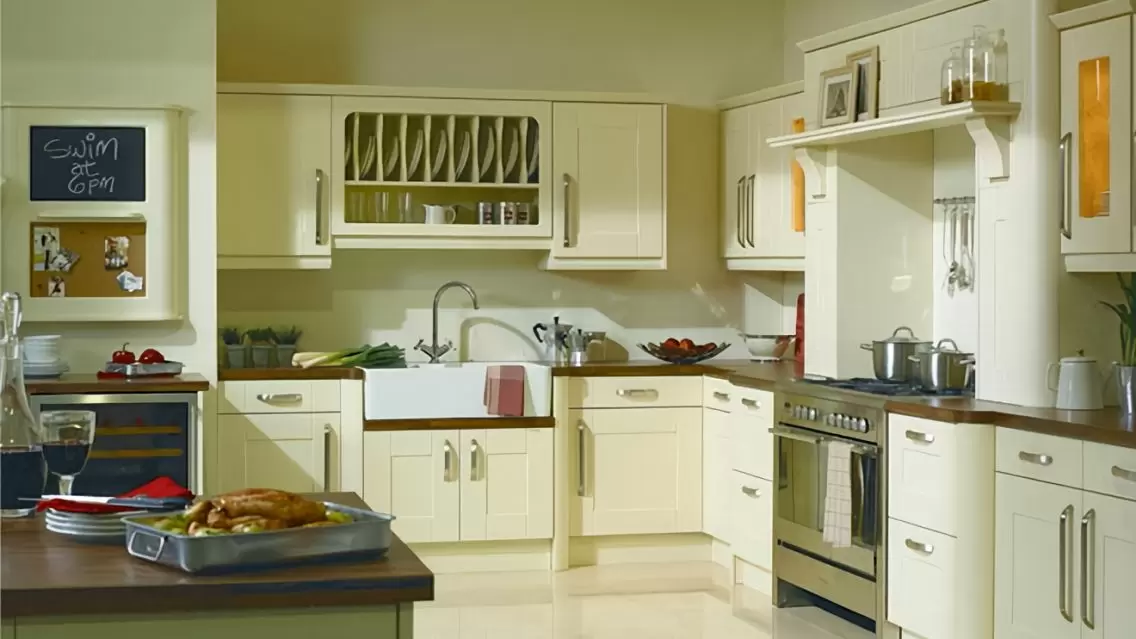 Cream color matt shaker kitchen cupboard in country style