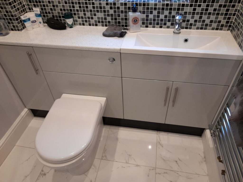 Bathroom using Slab High Gloss Light Grey kitchen doors